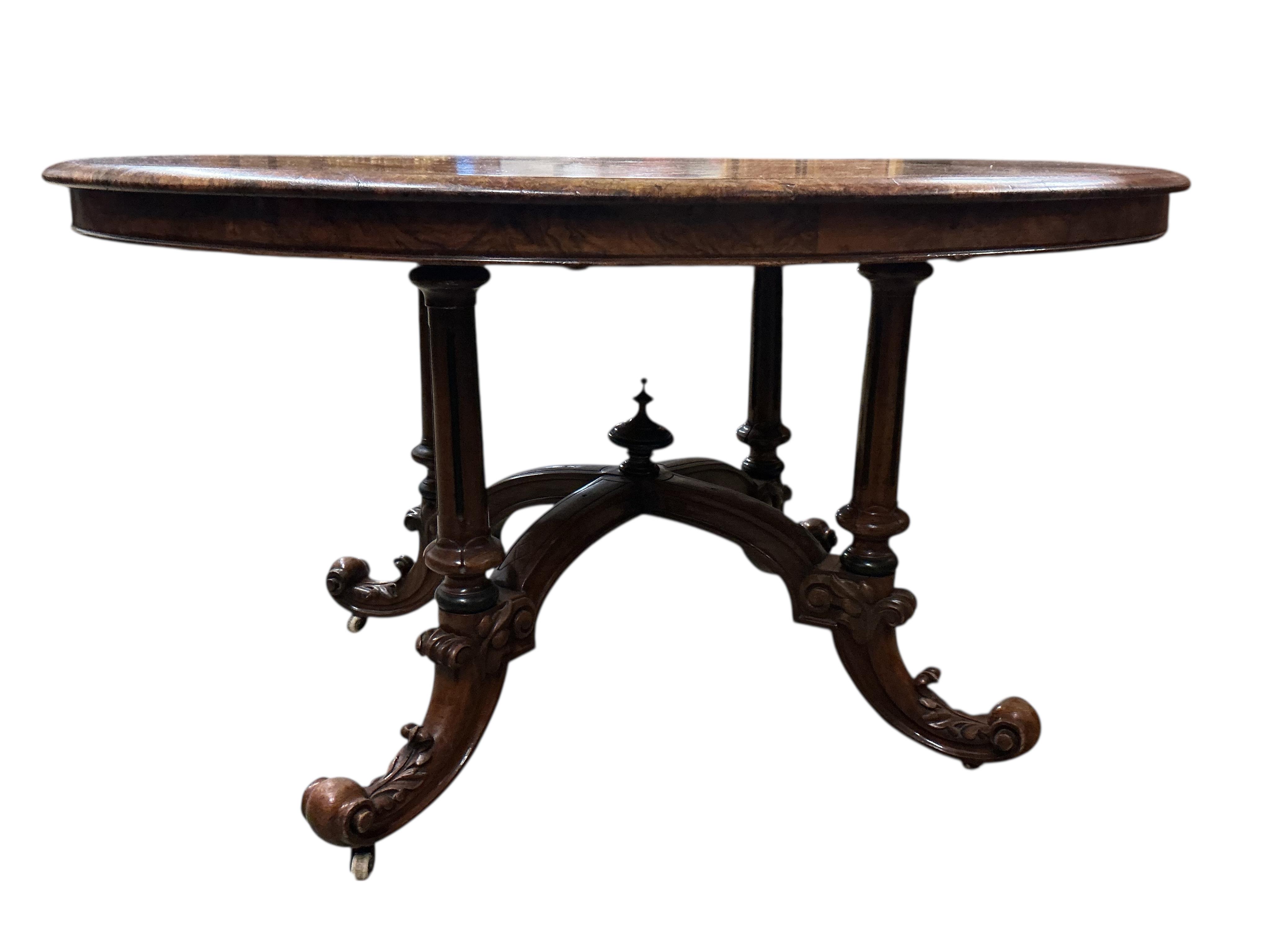 A late Victorian inlaid walnut oval loo table, width 130cm, depth 100cm, height 70cm